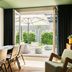 Hotel Schani Uno City Vienna lounge with open doors to a patio and umbrella-shaded seating