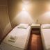 Hotel King Pyrros, Ioánnina: twin room with two single beds, bedside lamps, and wood flooring
