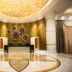 Winford Resort & Casino Manila lobby with gold chandelier, reception desk, and marble floor in Manila
