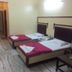 Hotel Rajmata Pvt Ltd Hyderabad twin room with two single beds, bedside phones, and a TV