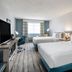 Hilton Garden Inn Jacksonville Ponte Vedra Sawgrass room with two beds, desk, and ocean-view window