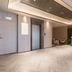Orange Hotel Beijing Japan Medical University lobby with elevator, seating area and reception desk in Beijing