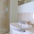 Hillhead Farm Lets in Stirling bathroom with shower enclosure and white sink