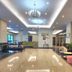 d'primahotel Kualanamu Medan lobby with chandelier, seating area, and glossy marble floor in Medan