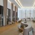 Meliá Llana Beach Resort & Spa in Santa Maria lobby with curved seating and tall windows