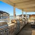 WorldMark Lake of the Ozarks in Osage Beach: lakeside rooftop grilling area with benches and water view