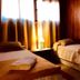 Hosteria La Raclette, San Martín de los Andes: cozy twin room with wood-paneled walls and two beds