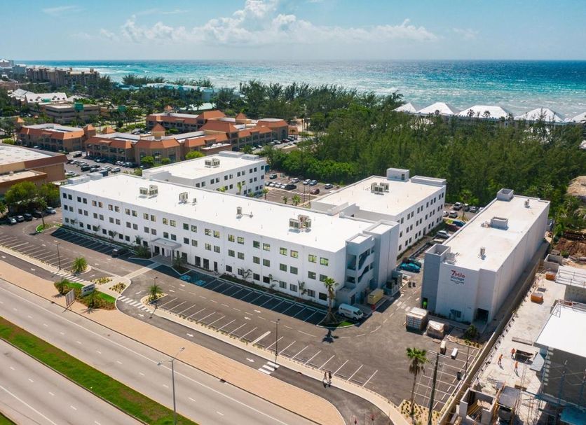 Governors Village in George Town near Seven Mile Beach Corridor, white apartment buildings beside the ocean