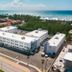 Governors Village in George Town near Seven Mile Beach Corridor, white apartment buildings beside the ocean