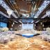 Jpark Island Resort & Waterpark in Lapu-Lapu City banquet hall with round tables and a central stage