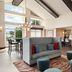 Hampton Inn & Suites Ft. Wayne-North lounge with lofted ceiling, seating area, and large windows in Fort Wayne