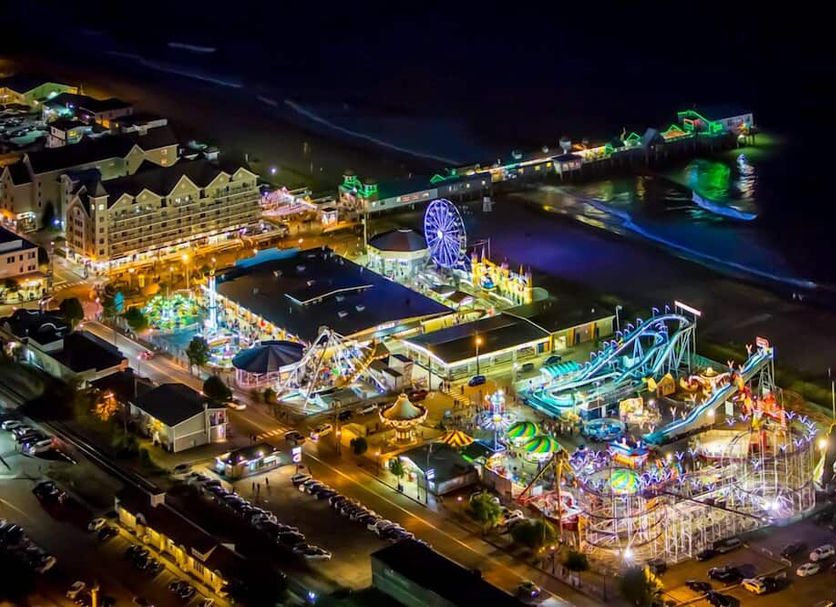 Alouette Beach Resort in Old Orchard Beach with illuminated seaside amusement park and beachfront views