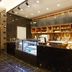 Ramada by Wyndham Seoul Dongdaemun cafe counter with display cases, shelves, and pastries in Seoul
