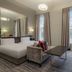DoubleTree by Hilton London Greenwich guest room with king bed, seating area, and tall windows in London