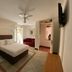 Hotel Casona Los Vitrales Zacatecas guest room with king bed, sofa, and tiled floor