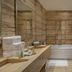 Hilton Skanes Monastir Beach Resort bathroom with soaking tub, walk-in shower, double sink vanity and glass partition