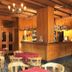 Hotel Pinzolo-Dolomiti in Pinzolo bar and dining area with wooden walls and tables