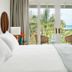 Couples Negril in Negril room with balcony doors open to tropical ocean view