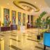 Bintumani Freetown lobby with stained glass windows, marble floor, and blue seating