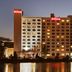 Hilton Philadelphia City Avenue in Philadelphia at dusk, waterfront view with illuminated hotel exterior