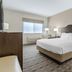 Best Western Timberridge Inn in Grove guest room with king bed, nightstands, lamps and window seat