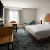 Hampton Inn by Hilton Hopewell Fort Lee guest room with king bed, desk, chair and window light in Hopewell