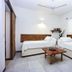 Otro Lado Lodge And Restaurant in Santa Teresa: twin guest room with wooden beds and coffee table