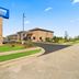 Americas Best Value Inn Byhalia exterior with entrance, sign, and landscaped drive in Byhalia