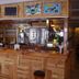 Hakuba Gondola Hotel bar area with wooden counter and stools in Hakuba