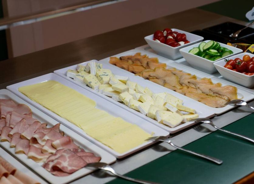 Hotel Summerhof in Bad Griesbach breakfast buffet with sliced meats, cheeses, smoked salmon, tomatoes and cucumbers