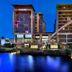 Cape Town Marriott Hotel Crystal Towers at dusk beside a reflective waterway and modern towers in Cape Town