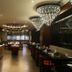 Ramada Encore by Wyndham Jalandhar restaurant interior with chandeliers and dining tables