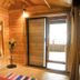 The Yuppi Hippi Beachpackers Hostel in Anjuna: wooden room with open door to balcony