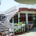 Hotel Casa di William in Khajurāho with a rooftop terrace, spiral staircase, and outdoor seating