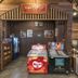 Suneta Hostel Khaosan in Bangkok ice cream counter and reception-style display inside a wood-paneled lobby