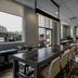 Residence Inn by Marriott Kingston Water's Edge dining area with tables, chairs, and large windows