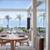 Beach Village at The Del, LXR Hotels & Resorts in Coronado, ocean-view dining terrace with palm trees