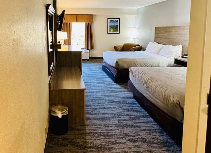 Quality Inn Danville - University Area guest room with two beds, TV, desk and seating area