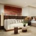 Grand Palladium Bavaro Suites Resort & Spa Punta Cana suite with king bed, sitting area and ocean view