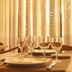 Hotel Rainha D. Amélia, Castelo Branco dining room with set table and wine glasses by sheer curtains