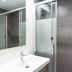 Ibiza Rocks Hotel in Sant Antoni de Portmany bathroom with sink, mirror and glass shower