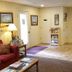 Parkwood Lodge Fish Creek lobby with seating area, brochure rack, lamp and front door
