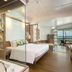 Katathani Phuket Beach Resort in Karon: beachfront suite with king bed and ocean view balcony