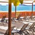 Sea of Cortez Beach Club in San Carlos with lounge chairs on a shaded seaside terrace and ocean view