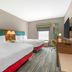 Hampton Inn Junction City guest room with two double beds, window and TV