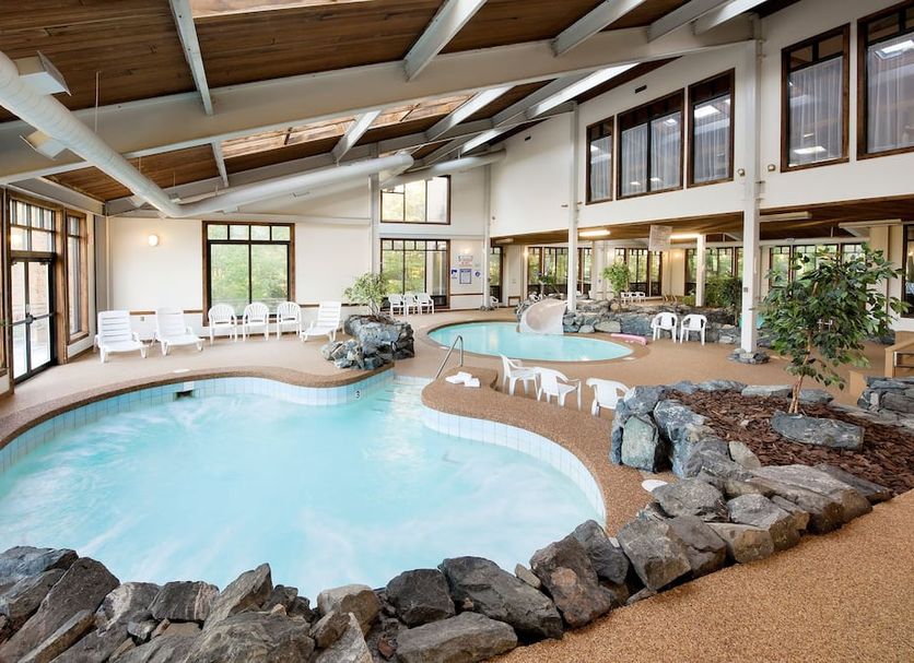 The Summit Resort in Laconia indoor pool with hot tub and seating area