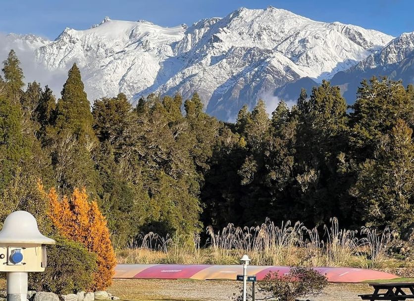 Franz Josef Top 10 Holiday Park with snow-capped mountain views in Franz Josef Glacier