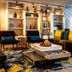 Stayeasy Maputo lounge in Maputo with colorful seating, shelving, and large window light