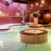 The Woodlands Inn in Wilkes-Barre indoor pool with circular hot tub and wood-paneled walls