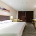 City Comfort Inn Foshan Zumiao Zhangcha guest room with bed, desk and TV in Foshan